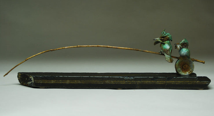bronze sculpture of two king fishers